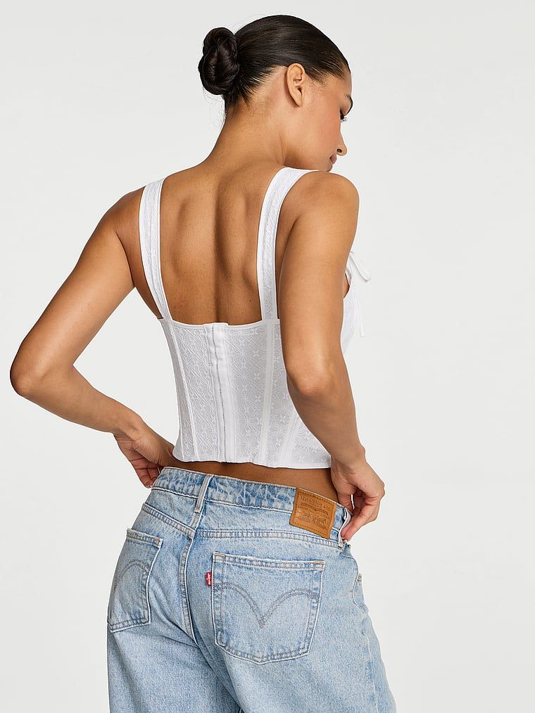 Topul de corset făcut din bumbac și dantelă. Produsul este alb și provine din colecția Dream Angels.