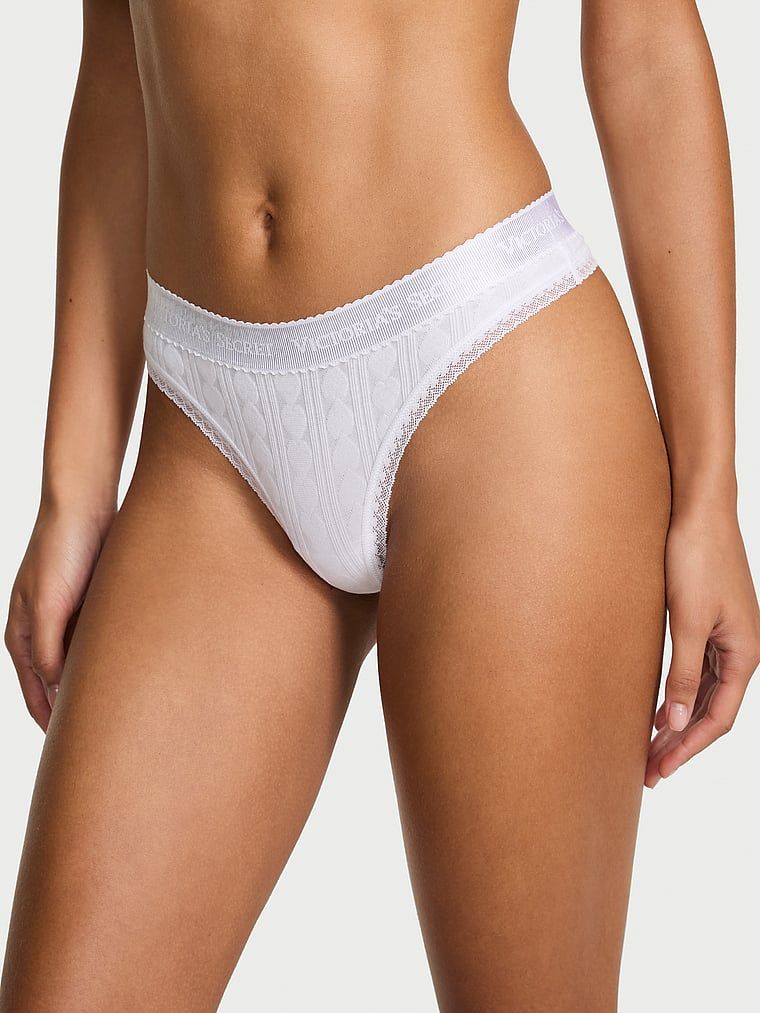 Tanga de bumbac cu inimi și logo-ul Heart Pointelle. Produsul este de culoare albă și provine din colecția Bumbac.