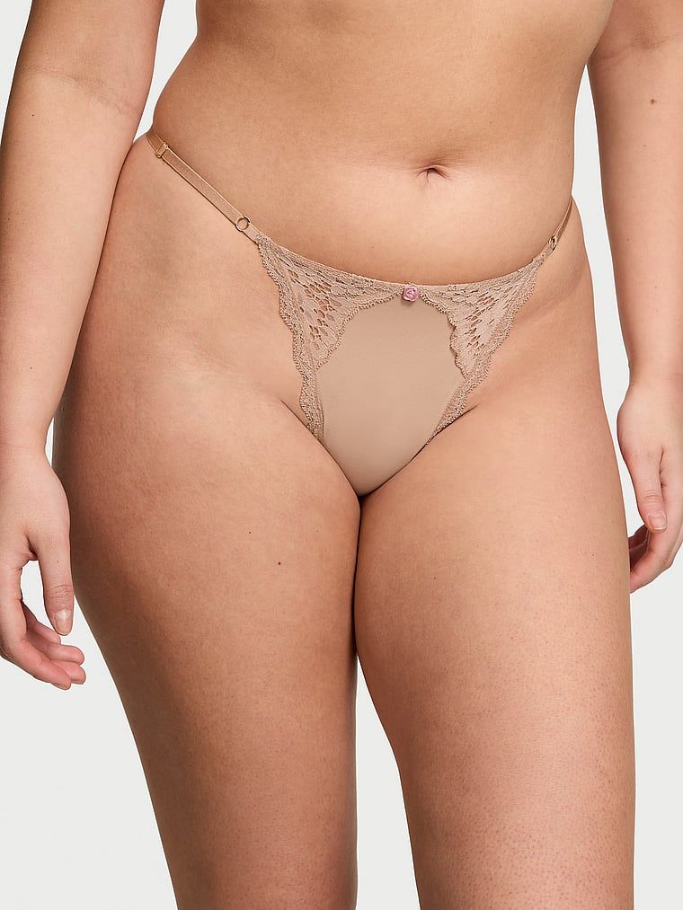 Tanga din dantelă cu bretele reglabile Lace-Trim V-String. Produsul este bej și provine din colecția Dream Angels.