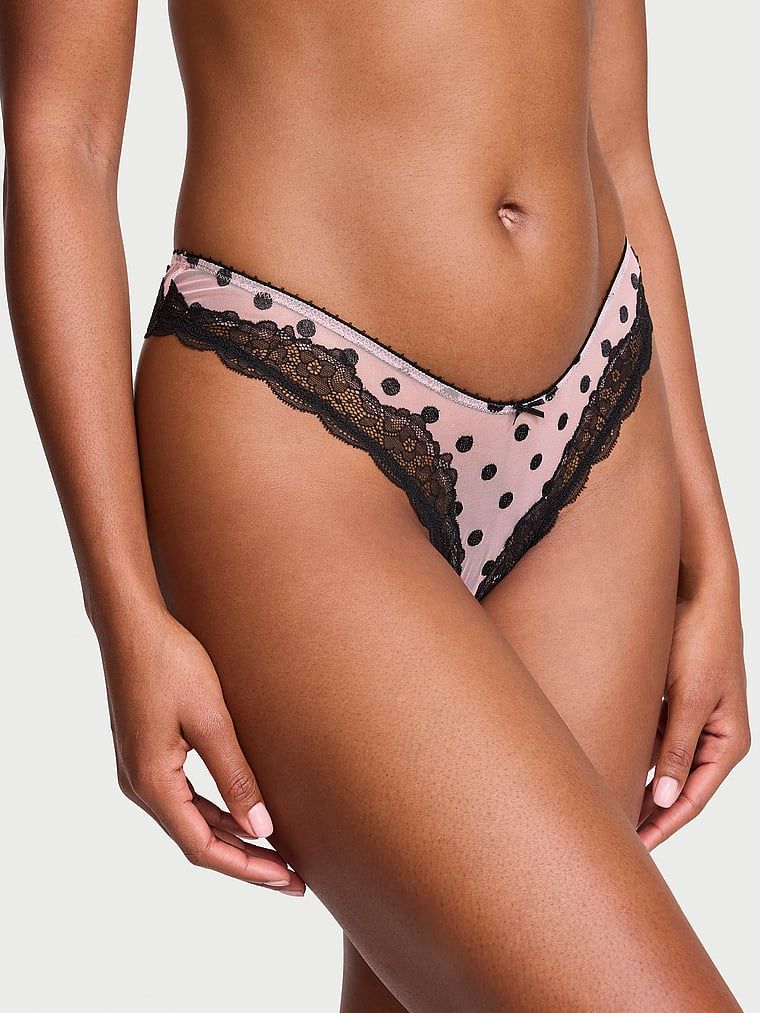Tanga Tease Sheer Dot din plasă înaltă cu picioare înalte. Produsul este modelat și provine din colecția Victoria's Secret.