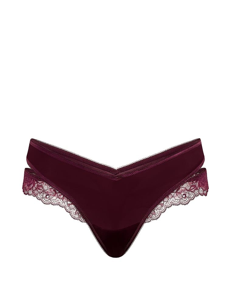 Tanga cu dantelă și decupaje pe laterale. Produsul este roz și provine din colecția Very Sexy.