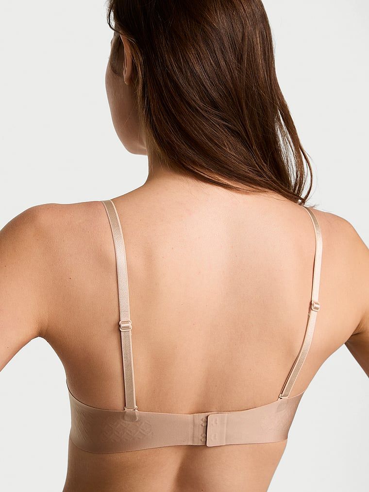 Suten fără bretele cu bretele ușor căptușite. Produsul este de culoare bej și provine din colecția Invisible by Victoria's Secret.