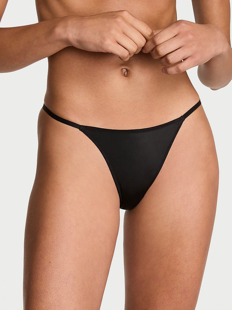 Chiloți brazilieni cu aripioare Angel Shine. Produsul este negru și provine din colecția Very Sexy.