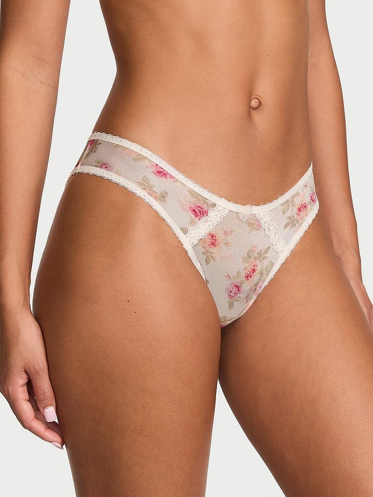 Chiloți brazilieni strălucitori cu decupaje în spate Sheer Shimmer Brazilian. Produsul are o culoare florală și provine din colecția Dream Angels.