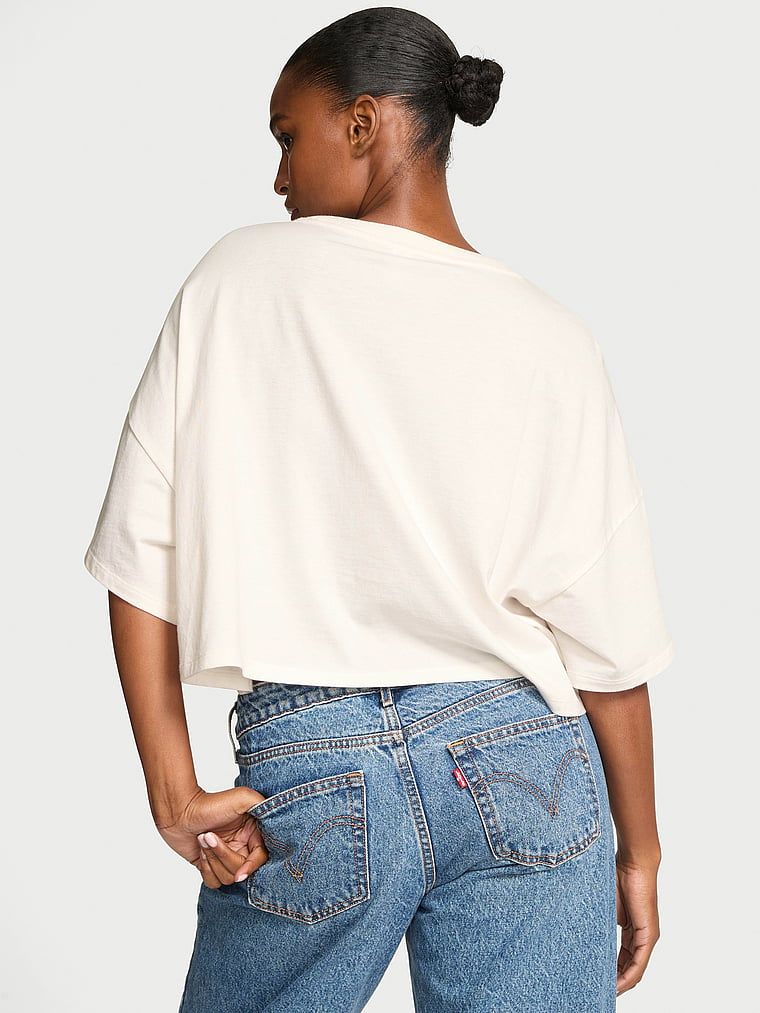 Tricou oversize din bumbac cu logo-ul mărcii. Produsul este de culoare albă și provine din colecția Angel Essentials.