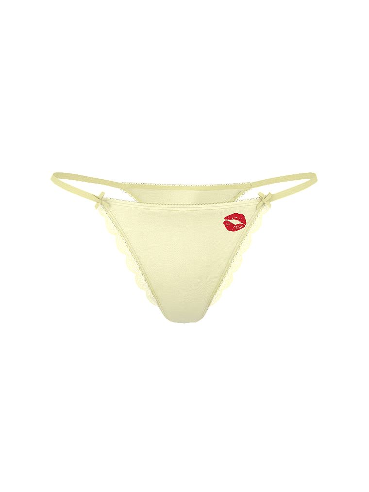 Tanga de satin cu picioare înalte, Tease Kiss. Produsul este galben și provine din colecția Victoria's Secret.