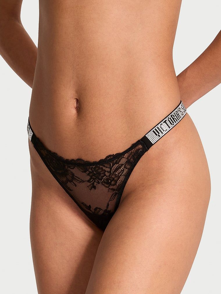 Tanga Shine Strap Rose Lace. Produsul este negru și provine din colecția Very Sexy.