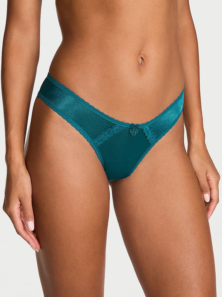 Chiloți brazilieni strălucitori cu decupaje în spate Sheer Shimmer Brazilian. Produsul este albastru și provine din colecția Dream Angels.