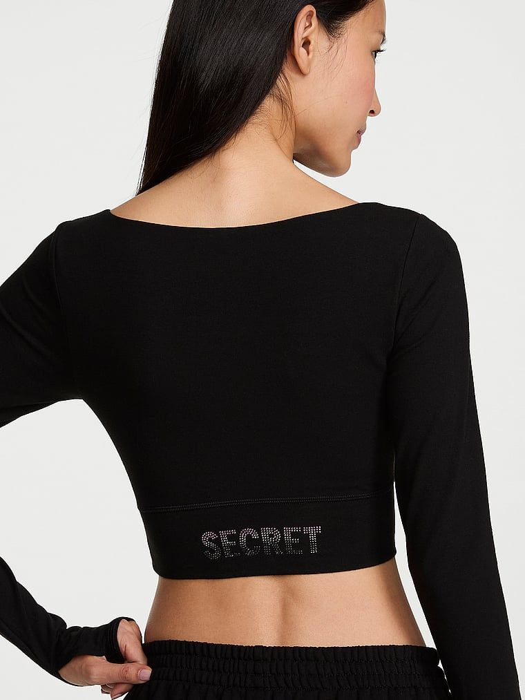 Bluză scurtă din bumbac cu mâneci lungi. Produsul este negru și provine din colecția Angel Essentials.