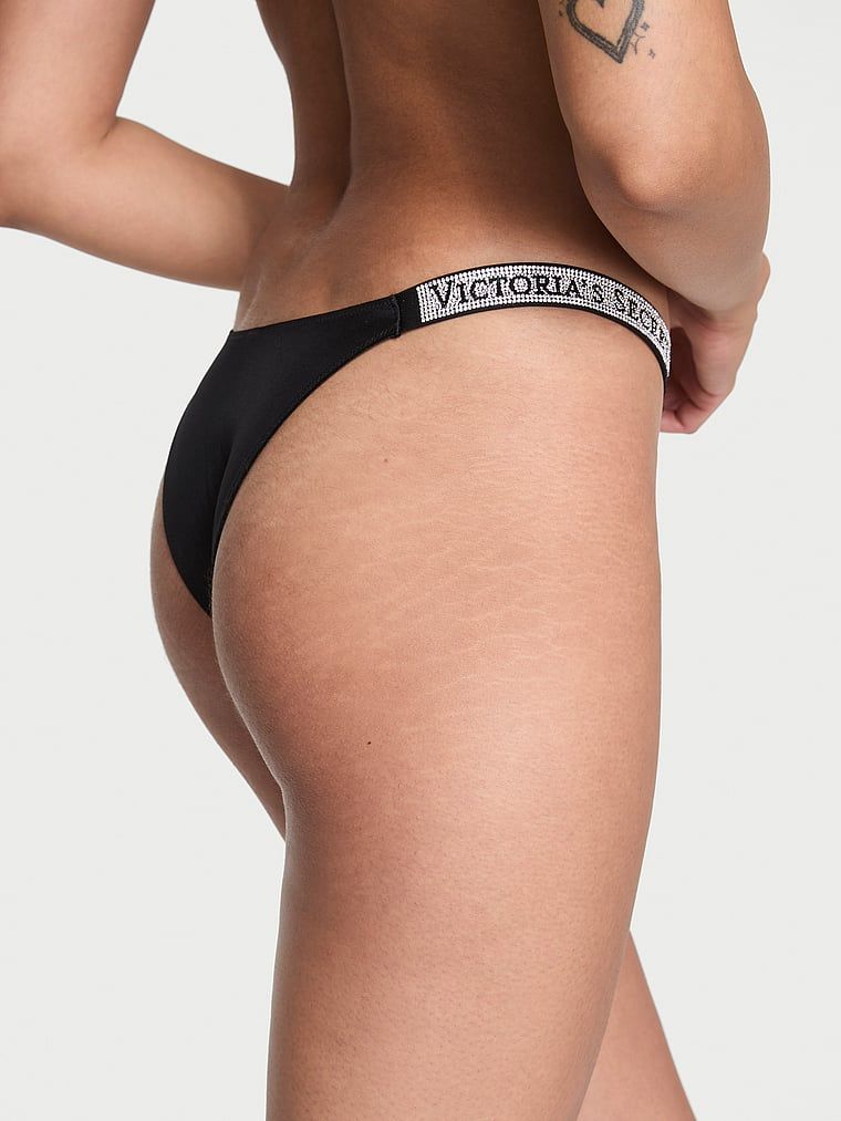 Chiloți brazilieni cu dungi braziliene Shine Trap. Produsul este negru și provine din colecția Very Sexy.