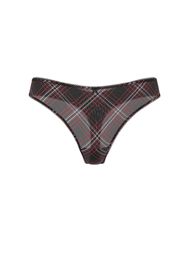 Tanga lucioasă cu plasă strălucitoare. Produsul este modelat și provine din colecția Lacie.