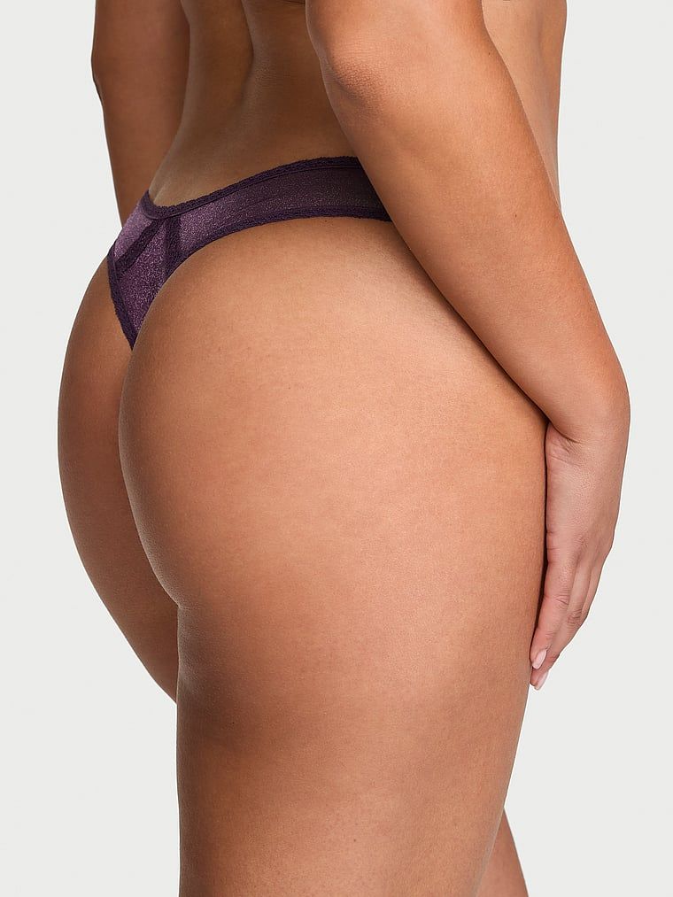 Shimmer Shimmer Shimmer Shiny Thong. Produsul este de culoare mov și provine din colecția Dream Angels.